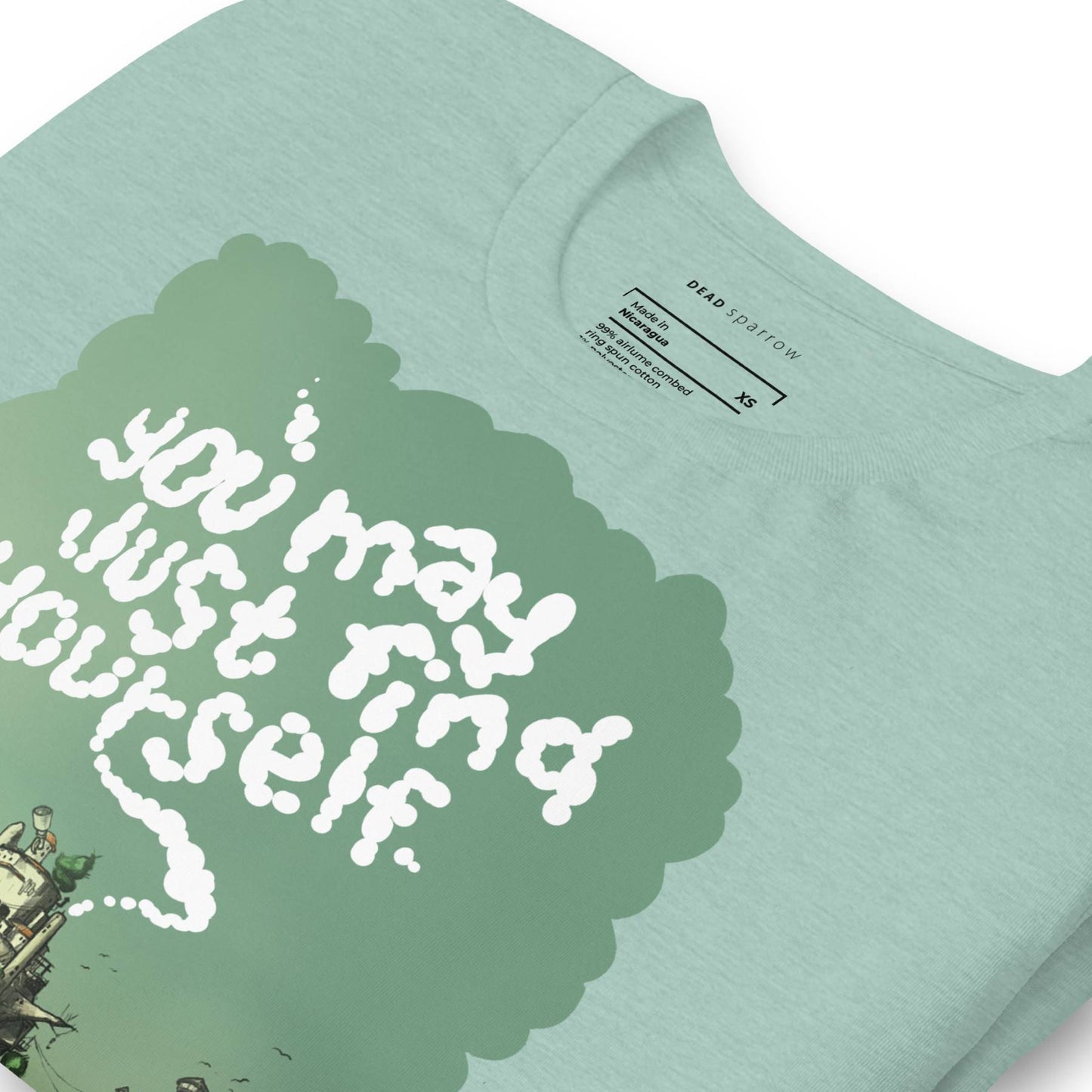 Zoomed in Heather prism dusty blue t-shirt for women. Text in the centre of the t-shirt "You may just find yourself". Product name Peacful.