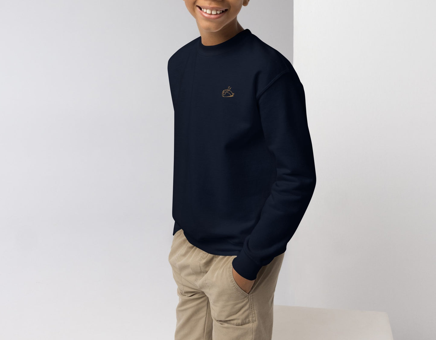 Image of a boy wearing 'Valuable' navy blue sweatshirt in size M. DEADsparrow.store
