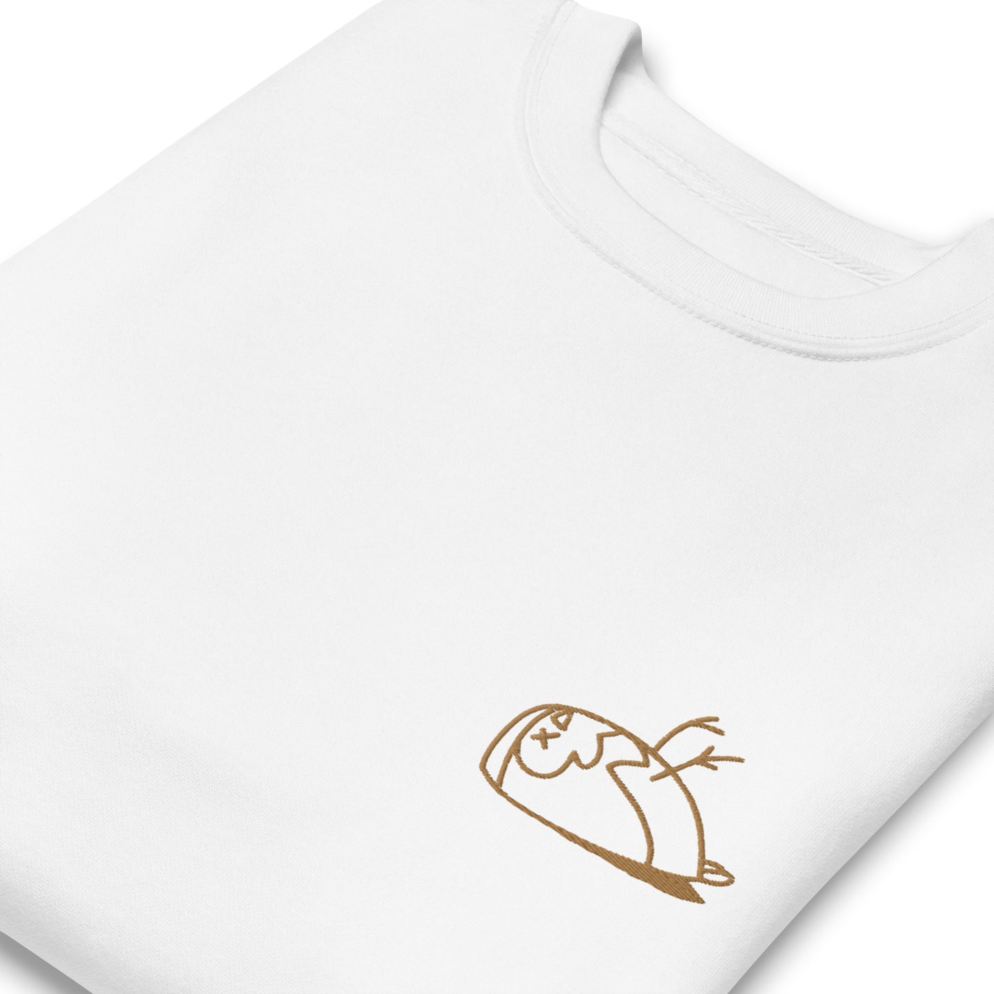 Close-up of a DEADsparrow sweatshirt for children. The sweatshirt is white, soft and folded. The sparrow is embroidered on the left side of the sweatshirt with gold coloured thread. Product name Valuable.