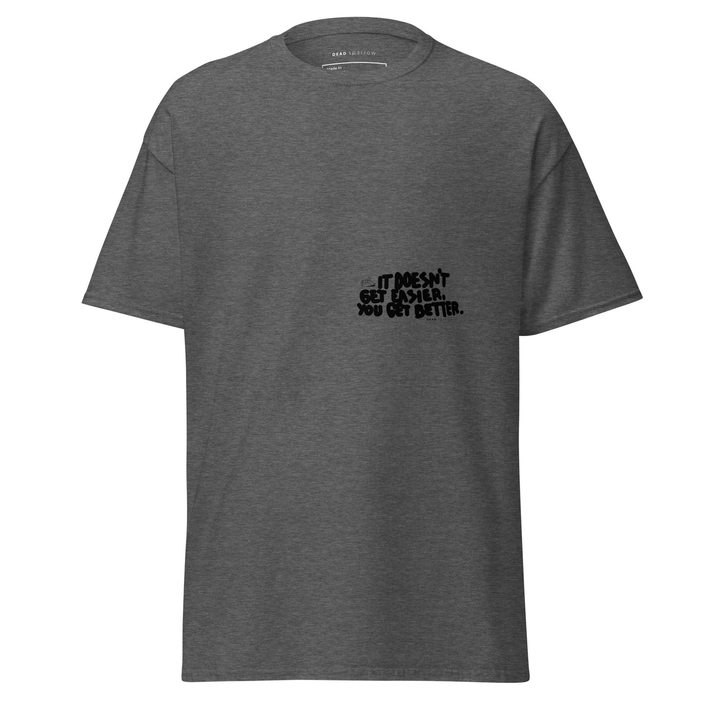 Image of a t-shirt for men. The color of the t-shirt is dark heather. on the left side of the t-shirt, there is a quote that reads "dosen`t get easier you get better". The product name of the t-shirt is Admirable.