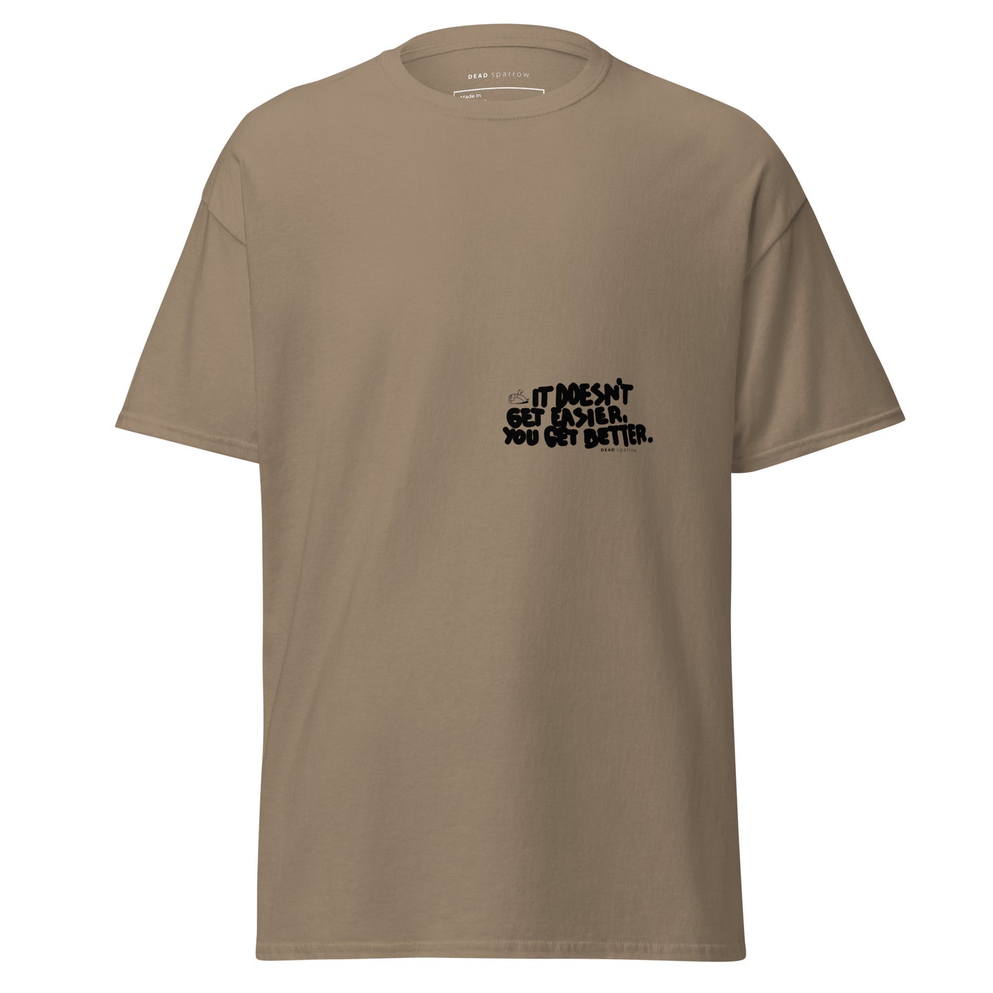 Image of a t-shirt for men. The color of the t-shirt is brown savana. On the left side of the t-shirt, there is a quote that reads "dosen`t get easier you get better". The product name of the t-shirt is Admirable.