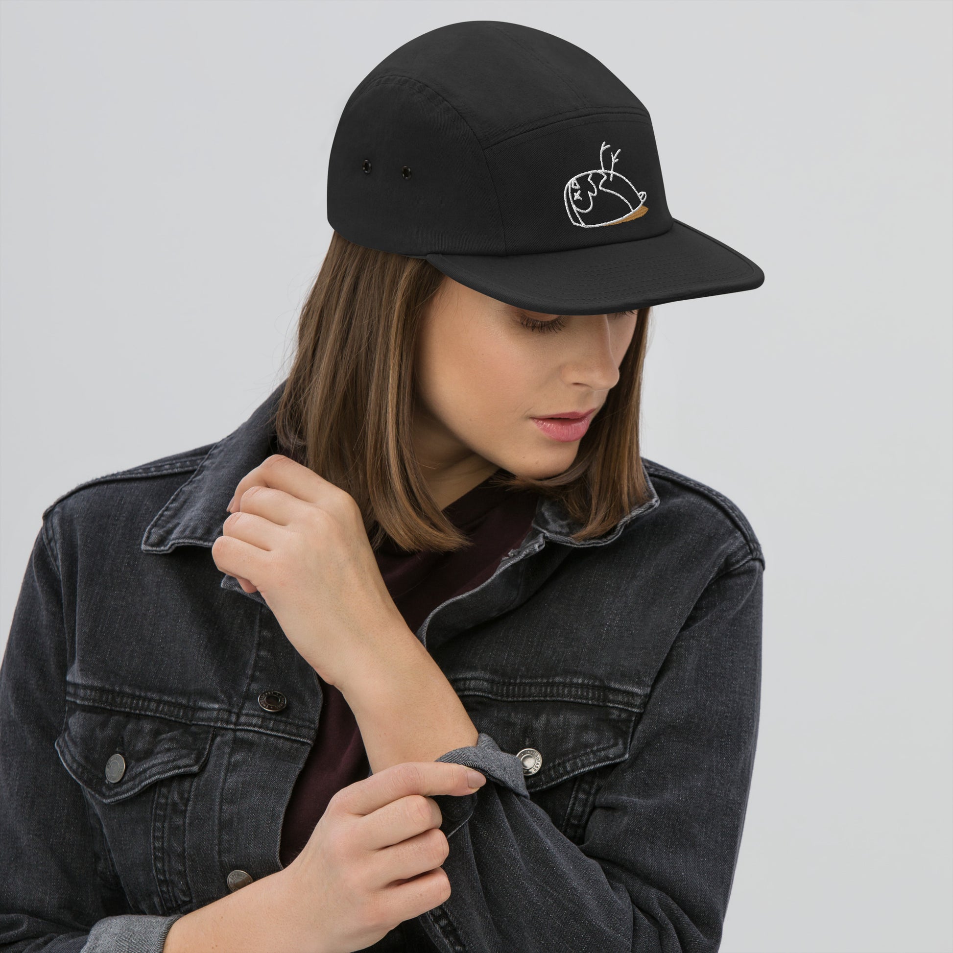 Close up of a woman wearing a DEAD sparrow Authentic cap in the colour black.