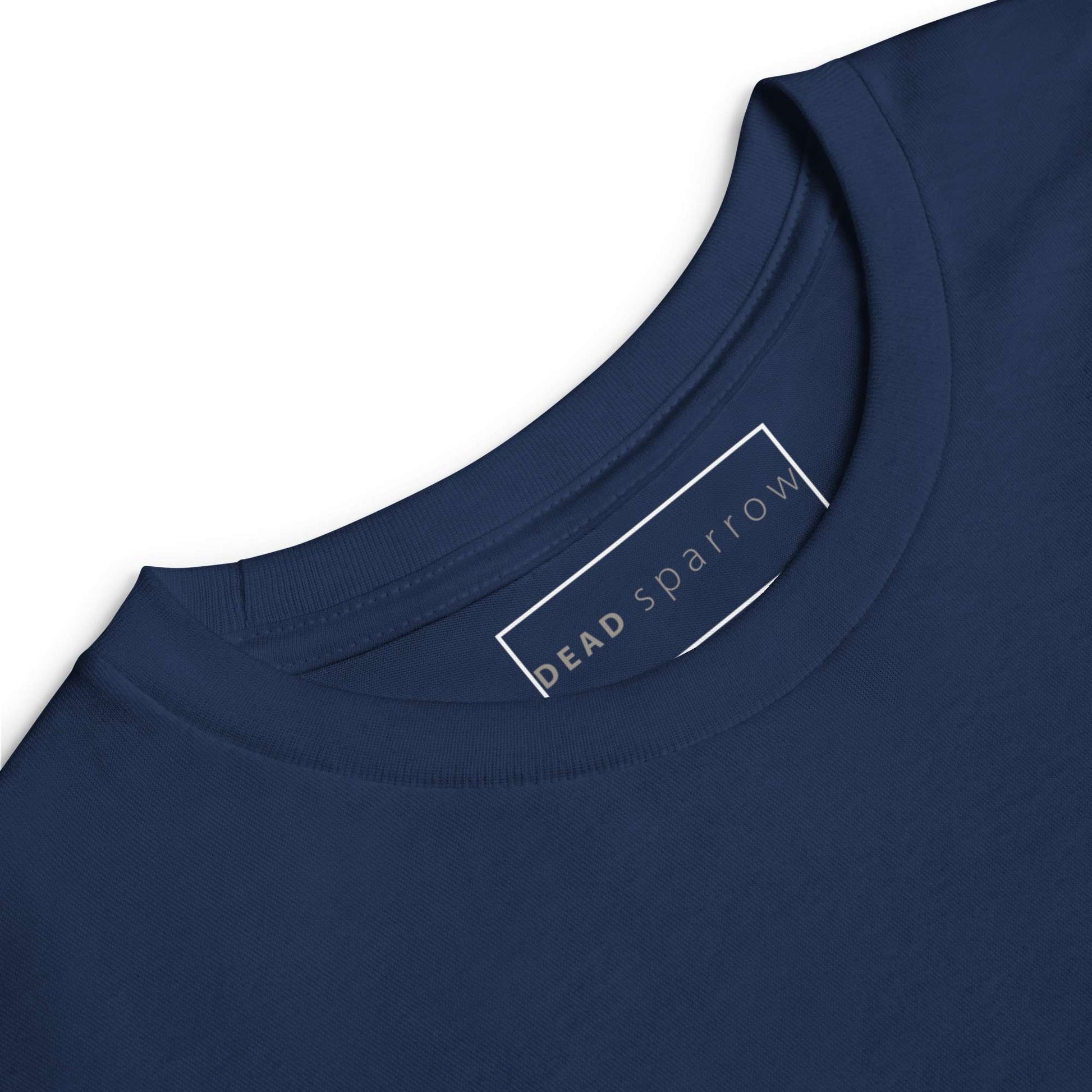 Close-up of Skilled, a long-sleeved t-shirt with the DEADsparrow logo printed on the left side. The image shows the crew neck of the long sleeve t-shirt in the colour navy. 