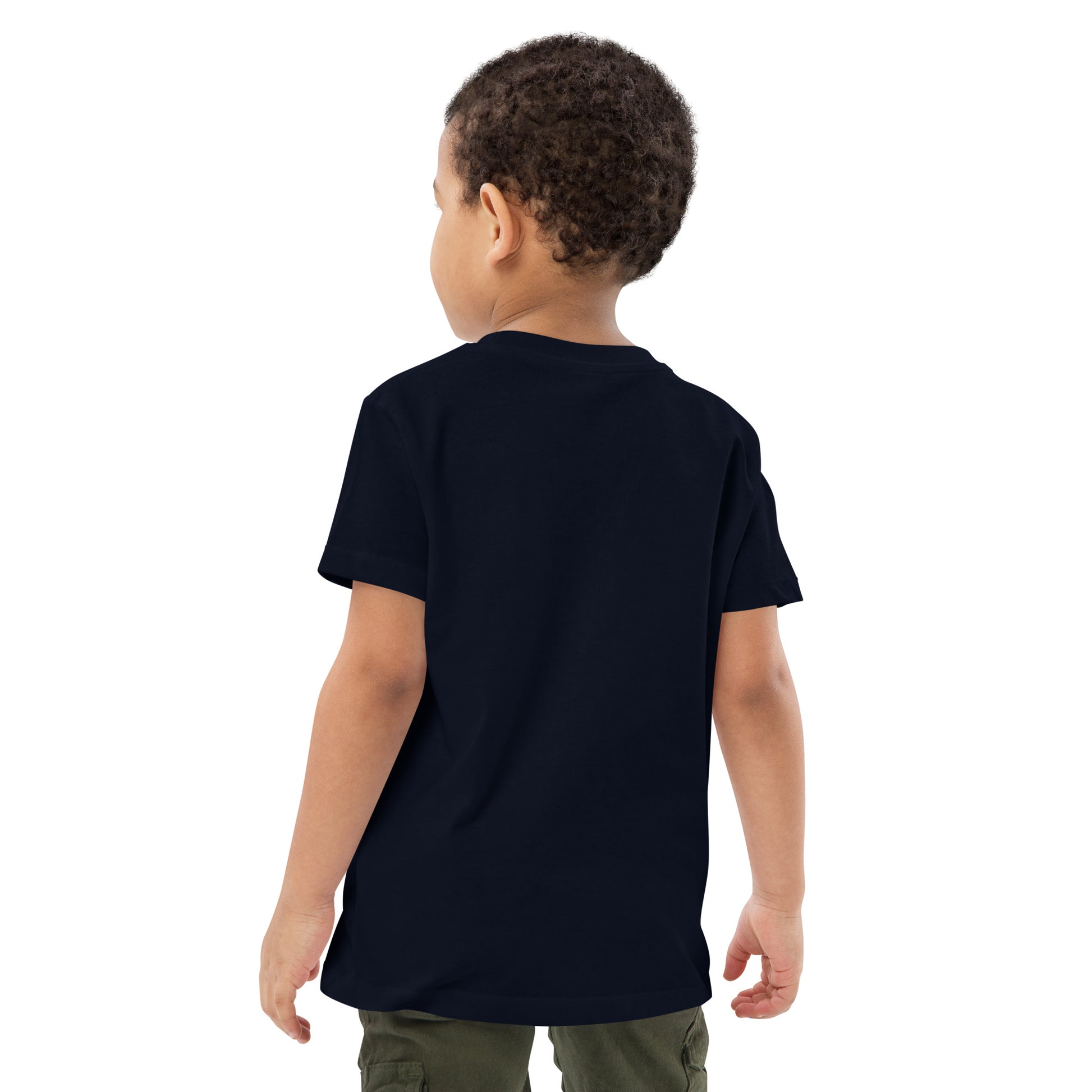 Image of a little boy wearing an eco-friendly French navy blue t-shirt. Print of a sparrow on the left side of the t-shirt. The print is white in colour. Product name Precious.