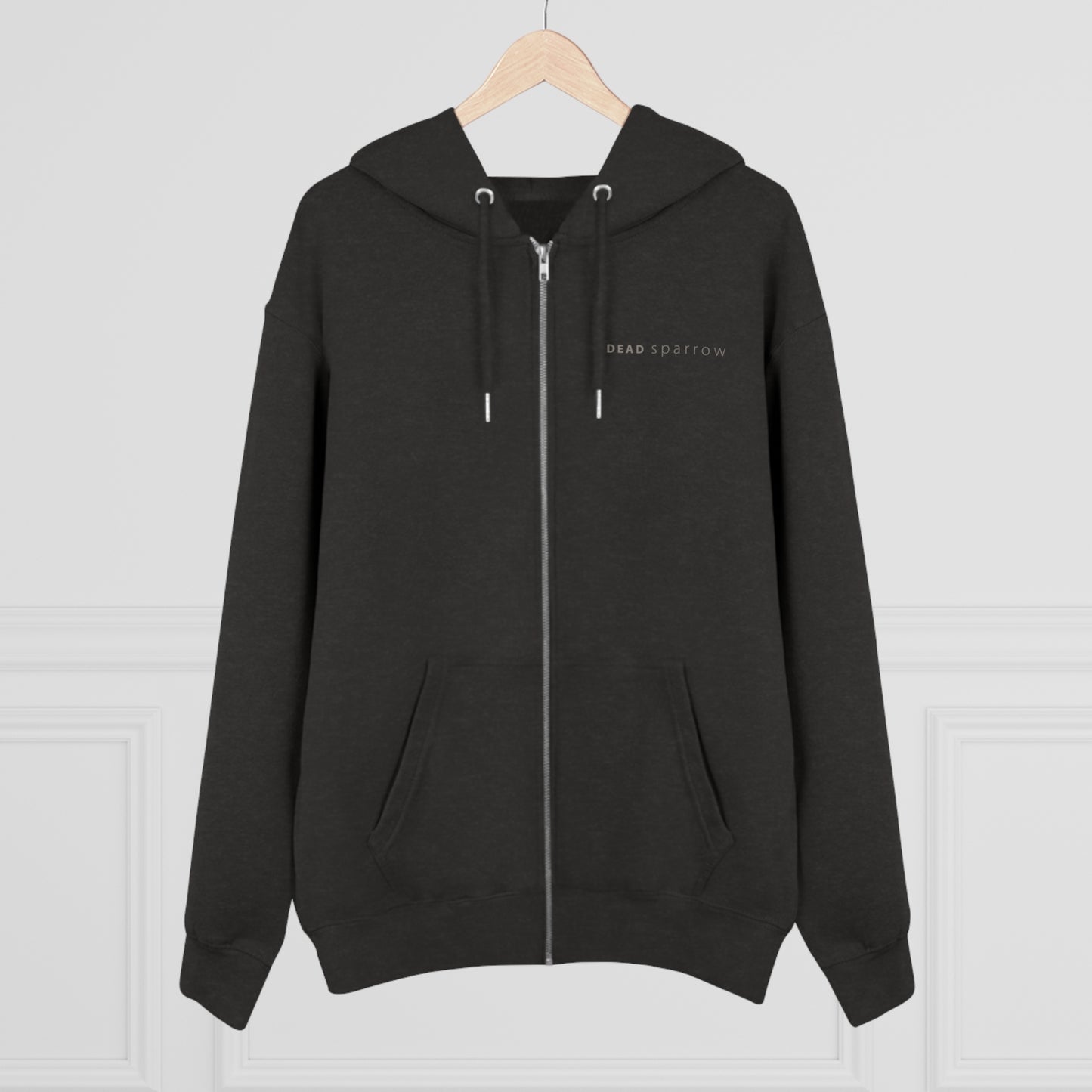 Image of a dark heather grey zip-up hoodie, item name Observent. The hoodie has a print on the left side, 'DEAD sparrow' (logo).