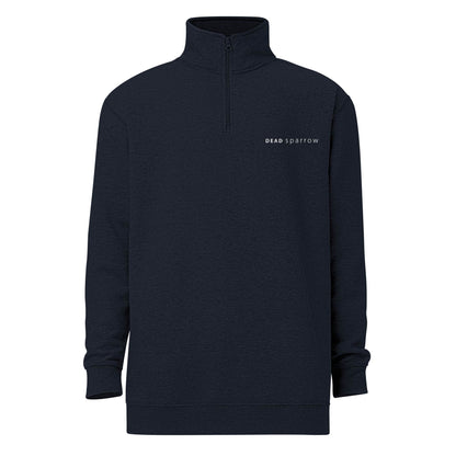 Close-up of navy zip up sweatshirt. DEADsparrow logo embroidered on the left side in white thread. Outstanding sweater has soft fleece frabric inside and matching color zipper.