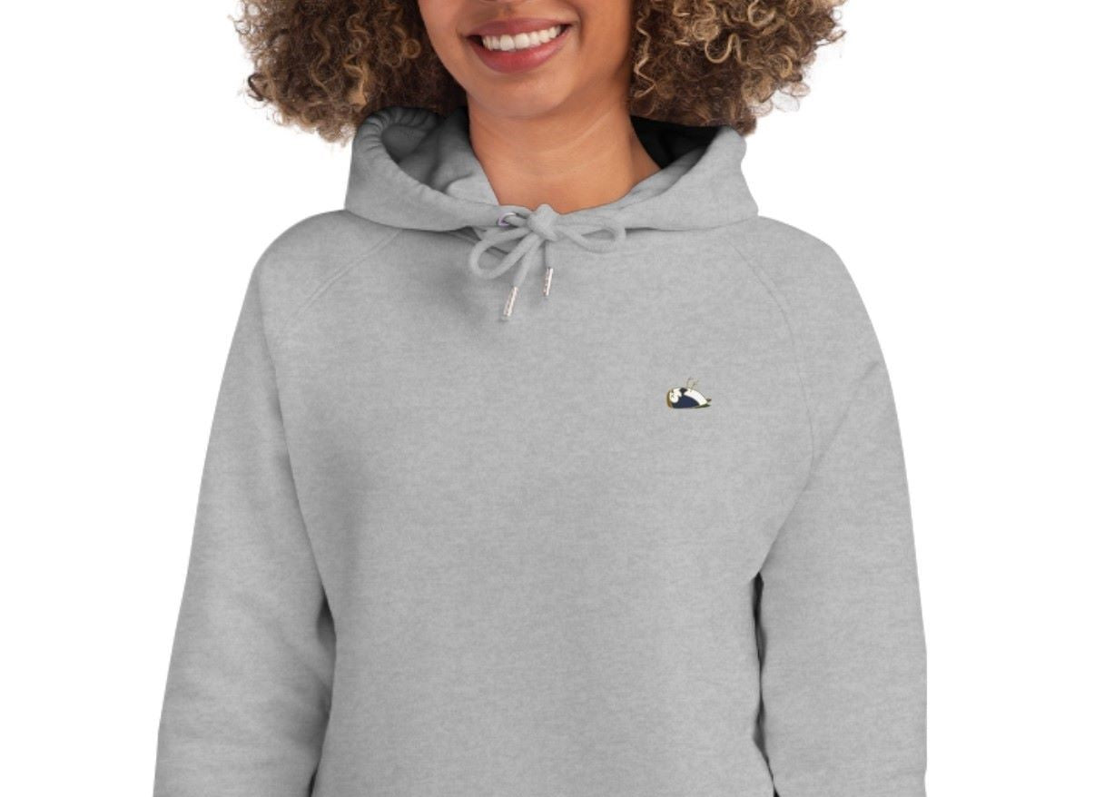 Close-up of a women wearing a heather grey hoodie, item Amazing.