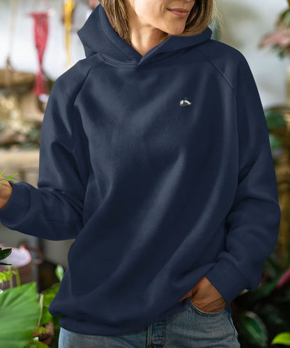 Close-up of a women wearing a french navy hoodie, item Amazing.