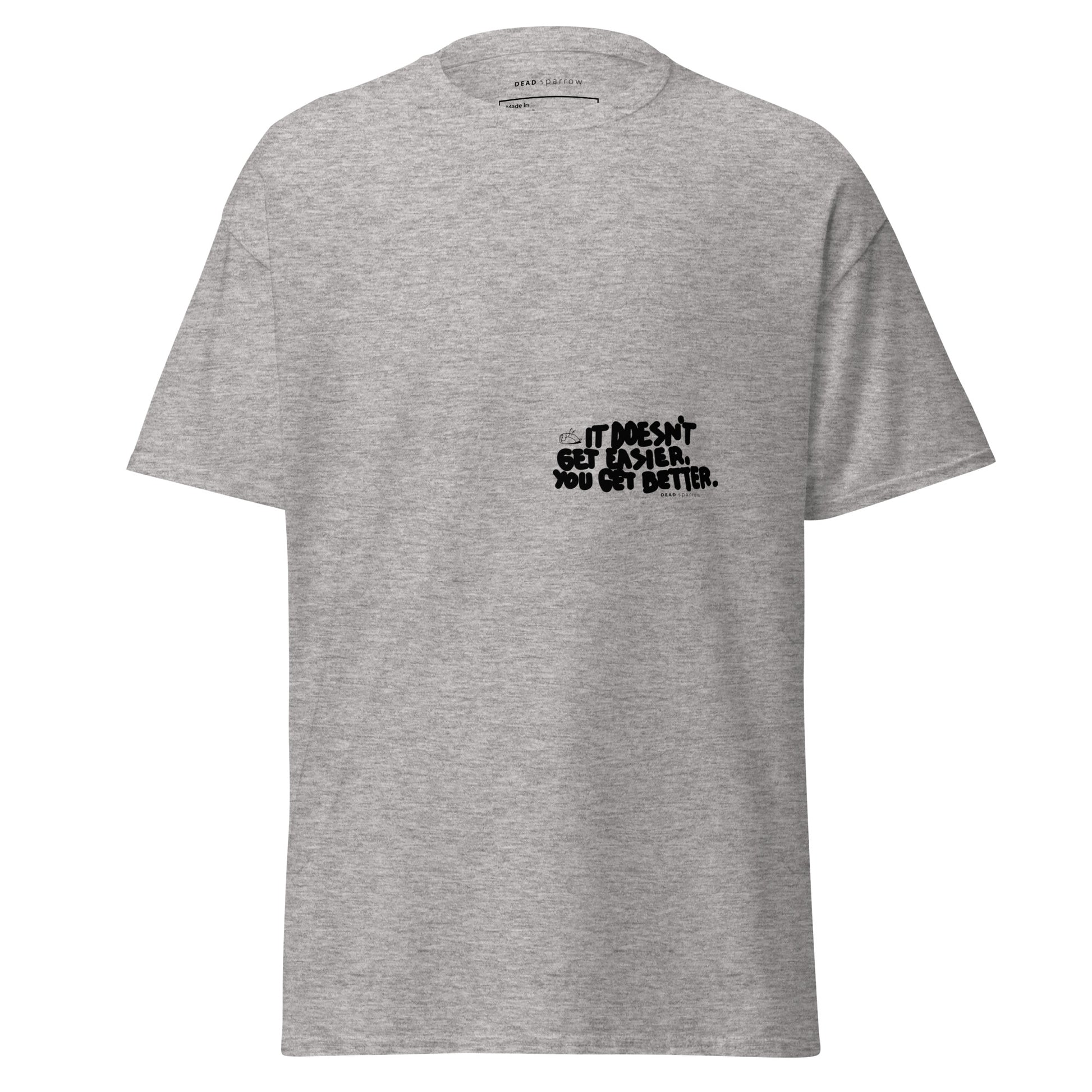 Image of a t-shirt for men. The color of the t-shirt is sports grey. on the left side of the t-shirt, there is a quote that reads "dosen`t get easier you get better". The product name of the t-shirt is Admirable. 