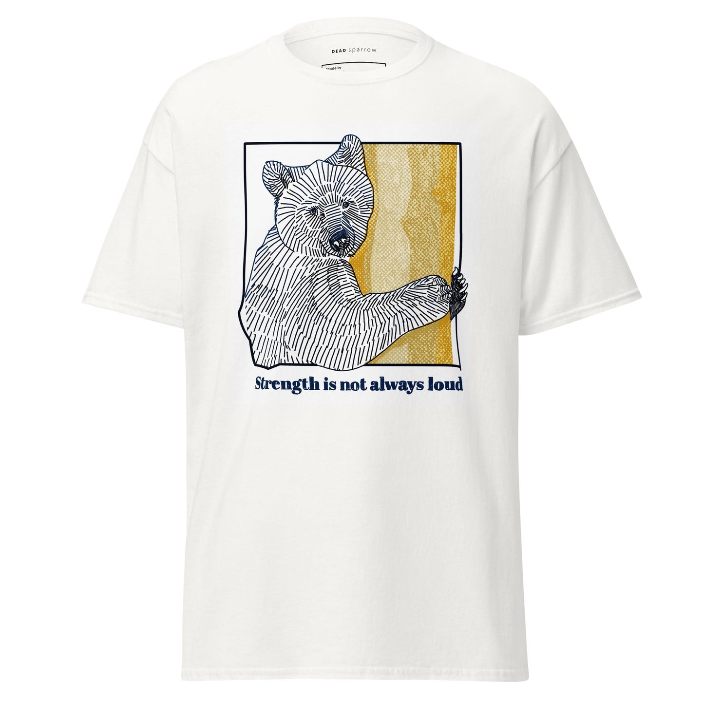 An image of a white T-shirt with a print of a bear. Below the print is the phrase "Strenght is not always loud".