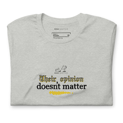 An image of a folded grey T-shirt with the quote "Their opinion dosent matter" on it.